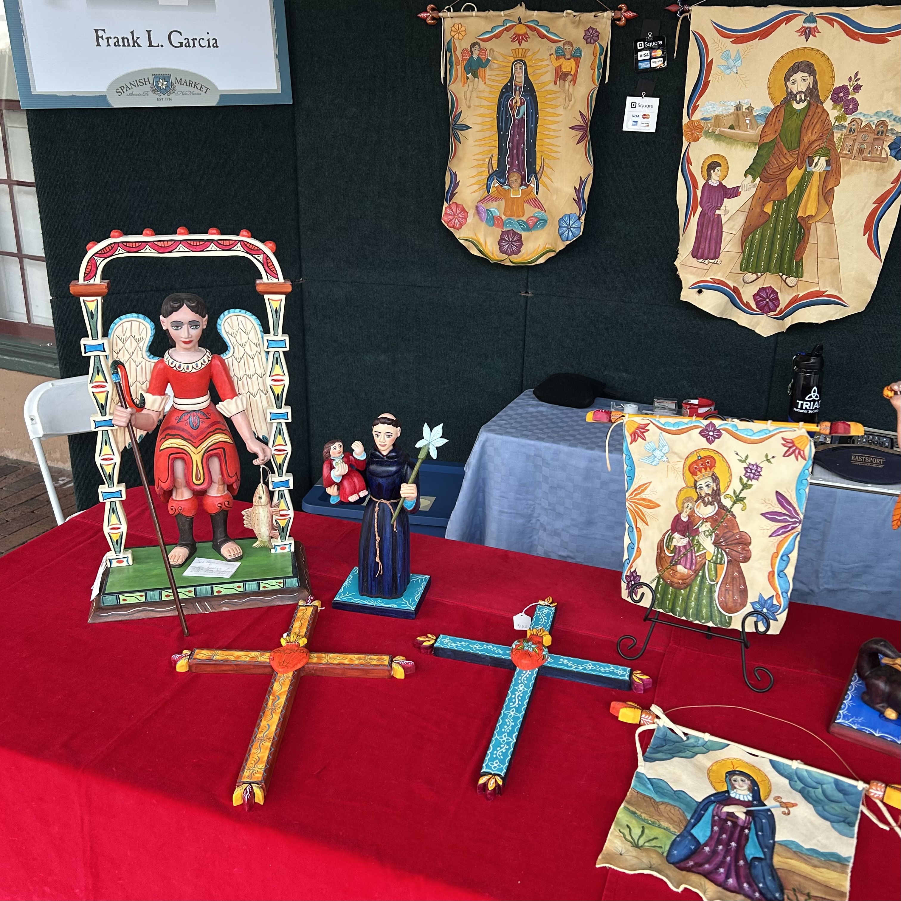 Display of devotional artwork by Frank L. Garcia at the 2026 Summer Spanish Market